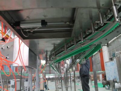 Fan blowing conveyor system for empty bottles